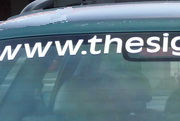 Vinyl vehicle lettering on a car window